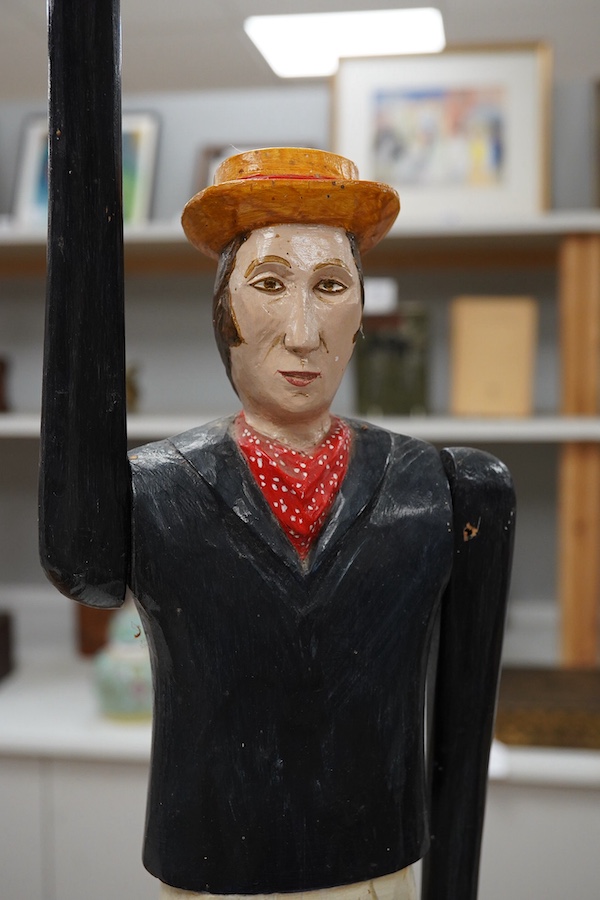 A carved and painted wooden ‘signalling’ figure with rotating arms, on stand, 94cm. Condition - good